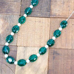 Green glass and white pearl bead necklace with large oval facet cut green beads.